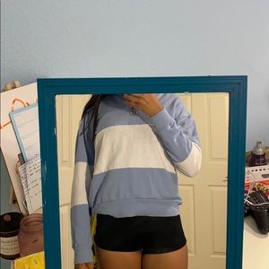 a blue and white stripped sweater